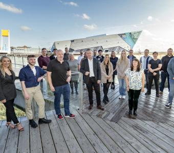 Group of Business Centre clients stood outside The Deep building