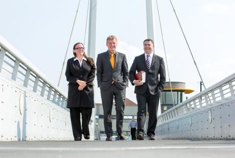 3 members of Amber solicitor team on footbridge