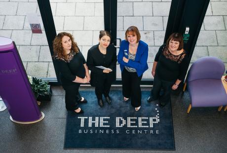 4 of the Business Centre team stood in  the reception area