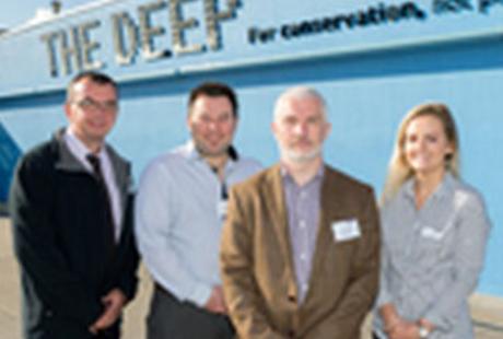 4 members of the RICS team stood in front of The Deep