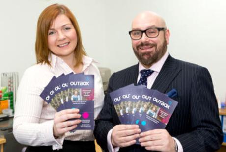 2 team members from Vobis holding leaflets